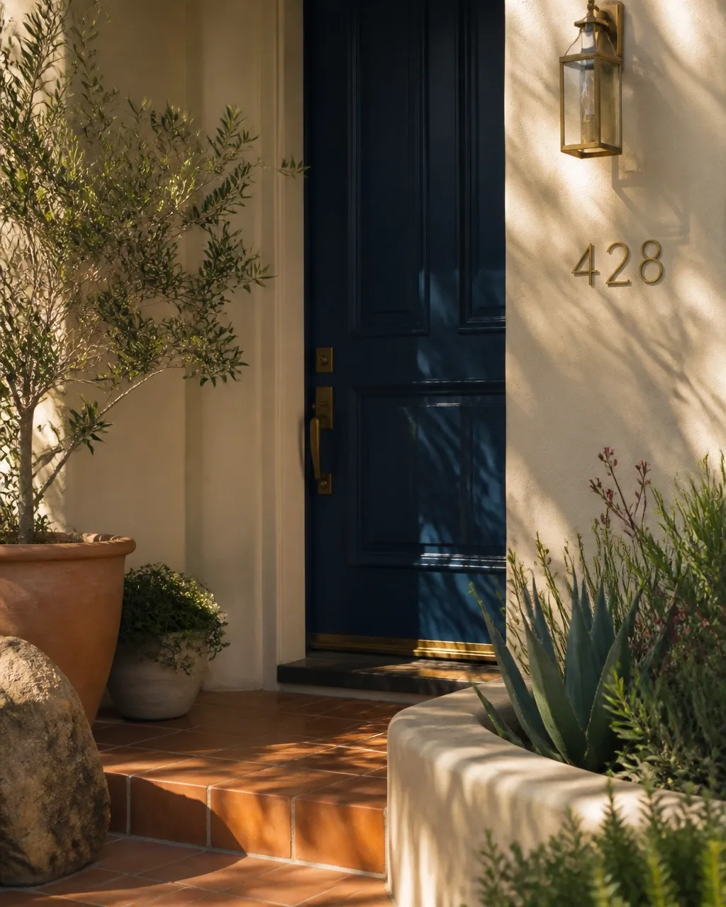 Welcoming entryway with warm tile and native plants